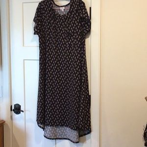 Carly dress black background with pink triangles